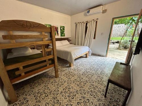 Ένα ή περισσότερα κρεβάτια σε δωμάτιο στο Costeño River Minca
