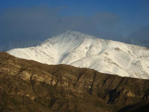 a mountain with snow on it in the distance at Las Margaritas in Potrerillos