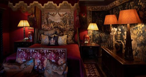 a bedroom with a king sized bed with a canopy at The Witchery by the Castle in Edinburgh