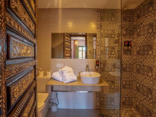 a bathroom with a sink and a shower at Riad Dar Sido in Marrakech