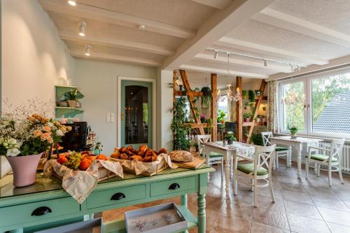 a kitchen with a table with fruits and vegetables on it at Pension Landhaus- Frühstückspension im Brombachtal in Brombachtal