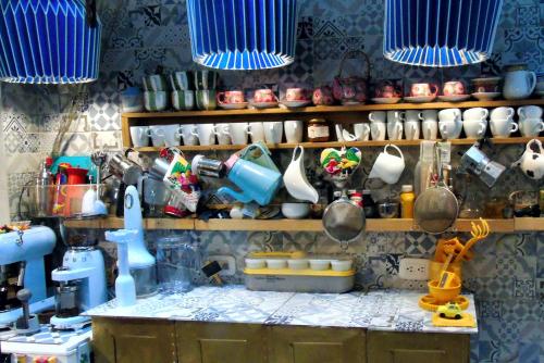a kitchen counter with pots and pans and utensils at Atelier for Artists in Bogotá