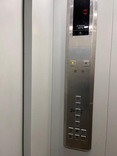 a elevator with a control panel in a building at JB Residency Zirakpur !! Top Rated & Most Awarded Property in Zirakpur in Zirakpur