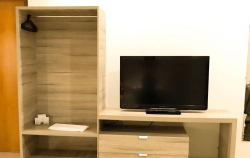 Hotel Renascer Ltdaにあるテレビまたはエンターテインメントセンター