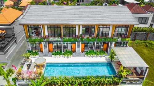 an aerial view of a house with a swimming pool at KARRA LOFT - Bali Invest Villas in Canggu