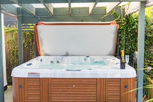 a bath tub with a white top in a garden at Channel View by Bloom Stays in Folkestone