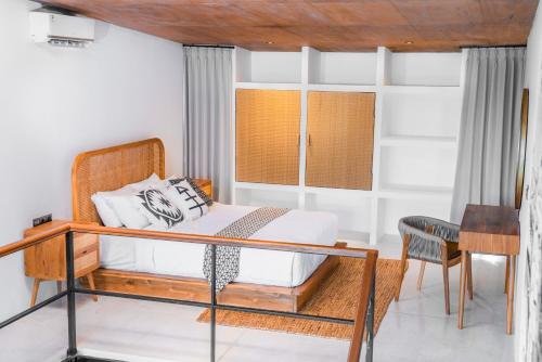 En eller flere senger på et rom på KAMMARA LOFT - Bali Invest Club