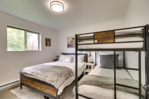 a bedroom with two bunk beds and a window at Whitefish Condo with Pool Access and Close to Hiking! in Whitefish