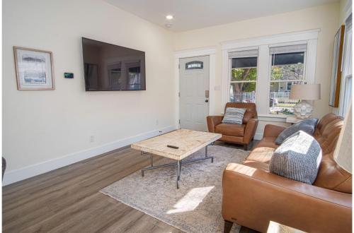 a living room with a couch and a table at Brand New Craftsman 2BR2BA Home in Denver Heights in San Antonio