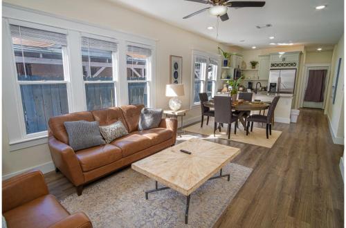 a living room with a couch and a table at Brand New Craftsman 2BR2BA Home in Denver Heights in San Antonio