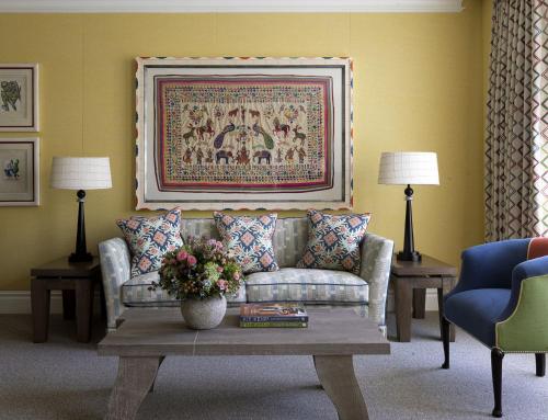 a living room with a couch and a table at The Soho Hotel, Firmdale Hotels in London