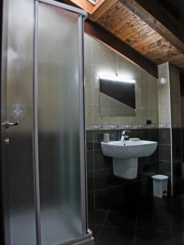 a bathroom with a shower and a sink at RB Della Torre in Porretta Terme