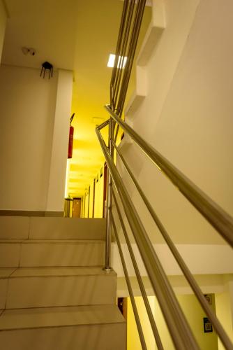 a set of stairs in a building with the sunset in the background at Hotel Mais1 in Campina Grande