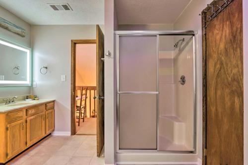 a bathroom with a shower and a sink at Cozy Cabin with Mountain Views Near SkyLift Park! in Gatlinburg