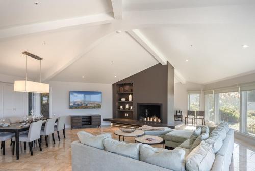 a living room with a couch and a table at 3906 Ocean's One Eleven home in Carmel