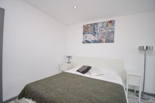 Ένα ή περισσότερα κρεβάτια σε δωμάτιο στο Poça Beach Apartment