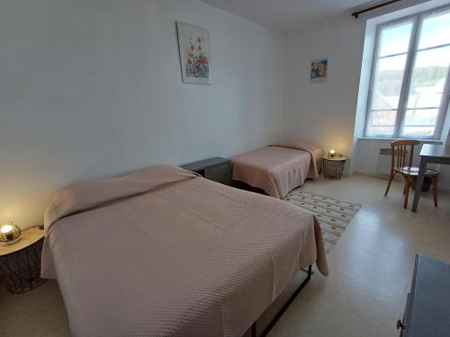 Ένα ή περισσότερα κρεβάτια σε δωμάτιο στο Le relais des randonneurs