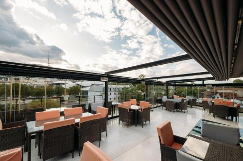 a restaurant with a view of the sky at Atrium Boutique Hotel in Tbilisi City