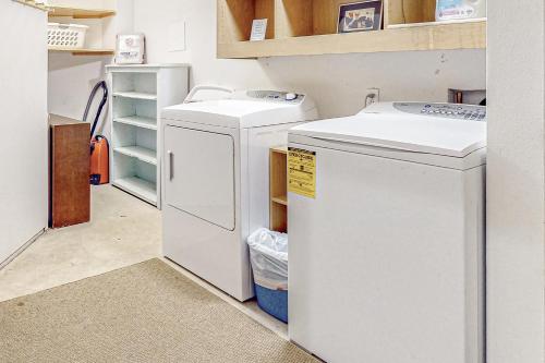 a laundry room with two washer and dryer at Hyak House in Snoqualmie Pass
