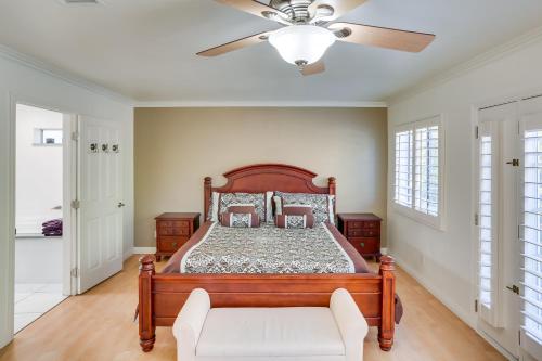 a bedroom with a bed and a ceiling fan at Spacious Running Springs Home with Mountain Views in Running Springs