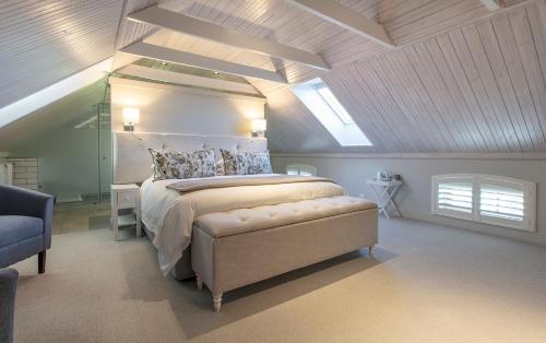 a bedroom with a large bed in a attic at Andreas Country House in Wellington