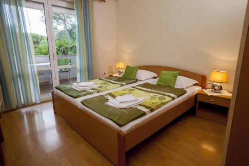 Ένα ή περισσότερα κρεβάτια σε δωμάτιο στο Apartments Villa Ban