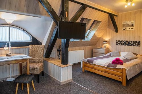 Postel nebo postele na pokoji v ubytování PROMYK - Apartamenty & Pokoje - dla dorosłych