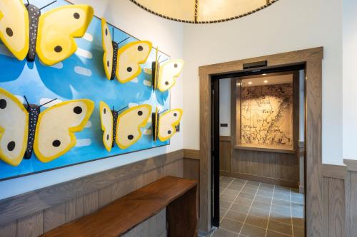 a hallway with a sign that reads bees at The Blake Residences in Taos Ski Valley