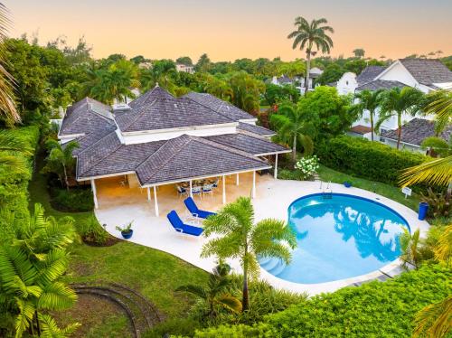 an aerial view of a house with a swimming pool at Coconut Grove 8 Luxury Villa by Island Villas in Saint James