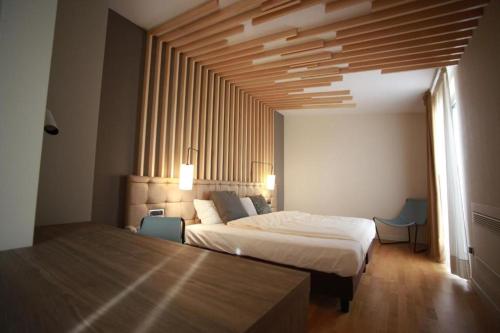 Postel nebo postele na pokoji v ubytování Hotel Corte Quadri