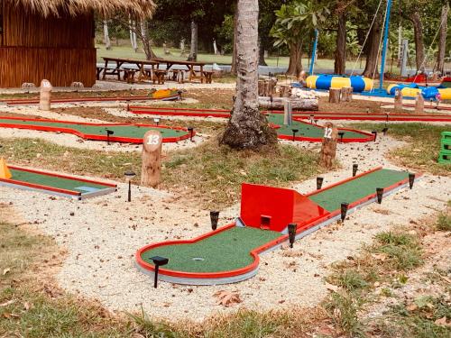 a group of miniature golf courses in a park at Caribbean Domicile in Las Terrenas