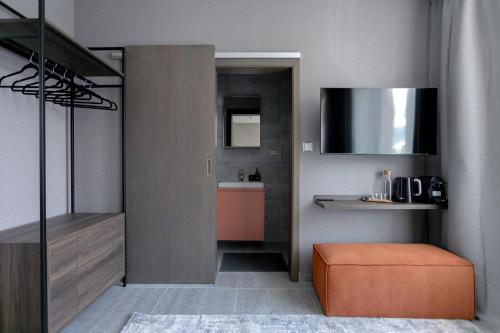 a small room with a kitchen with a sink at LUONG Europe Apartments in Prague