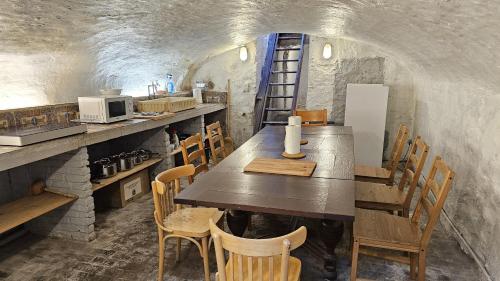 a dining room with a long table and chairs at CEP ECUYER in Brussels