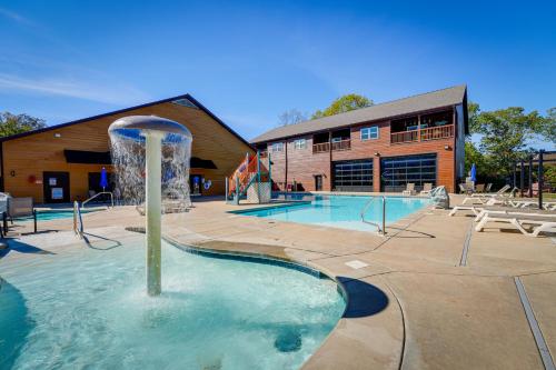 a pool with a fountain in the middle of a building at 2 Mi to Silver Dollar City! Spacious A-Frame Home in Branson