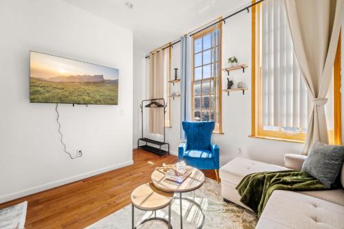 a living room with a couch and a table at Charming Home In Heart of City With King Size Bed! in Philadelphia