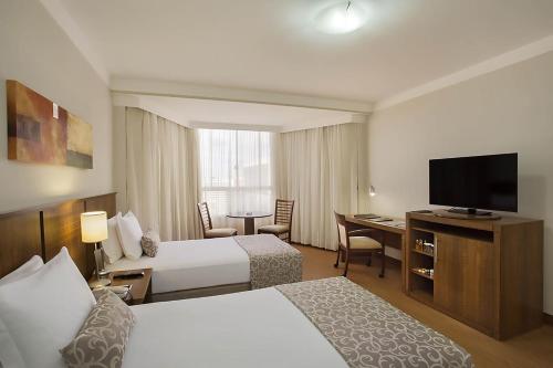 Cama ou camas em um quarto em Windsor Plaza Brasilia