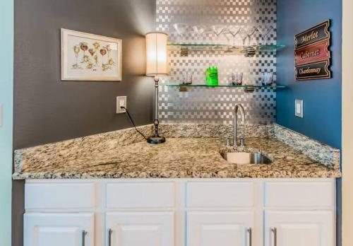a kitchen with a sink and a counter top at Palacio Unit 805 in Pensacola