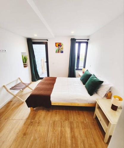 a bedroom with a large bed in a room at Vila Loki in Funchal