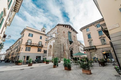 a street in a city with buildings and plants at P&P Borgo Apartment in Bergamo