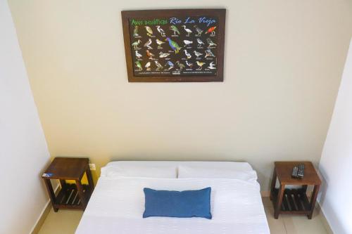 Ein Bett oder Betten in einem Zimmer der Unterkunft Hotel Quindio Campestre