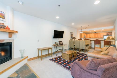a living room with a couch and a fireplace at Bear Creek Lodge 110A in Telluride