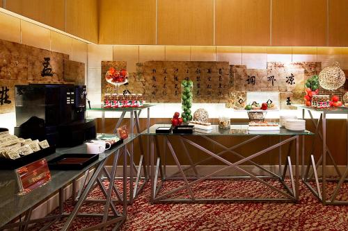 a room with a counter with food on it at Sheraton Xi'an Hotel in Xi'an