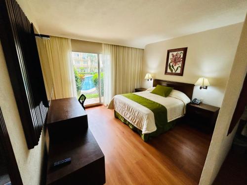 En eller flere senge i et værelse på Hotel Villa Florida Córdoba