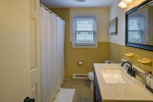 a bathroom with a sink and a toilet at Boston Duplex with Foosball Table 11 Mi to Downtown in Boston