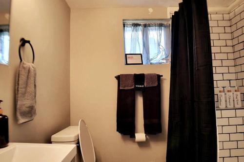a bathroom with towels hanging on the wall at 2 bd 2 bath in Fountain Square- 5 Min to Downtown in Indianapolis