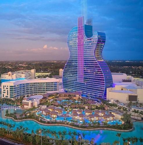 a hotel with a guitar shaped building with a resort at Florida Luxe, Brand new 4 Bed Property with a Private Jacuzzi in Tampa