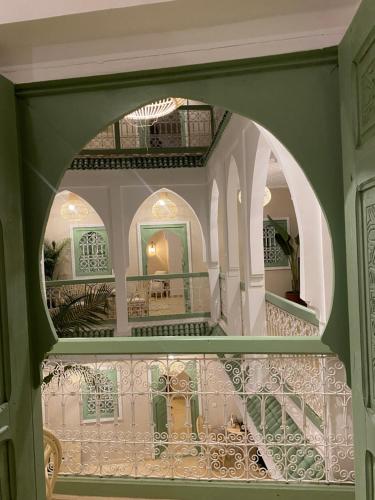 a view through an archway of a building at Riad Chic in Marrakesh