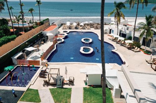 an aerial view of a swimming pool at the beach at The Inn at Mazatlan in Mazatlán