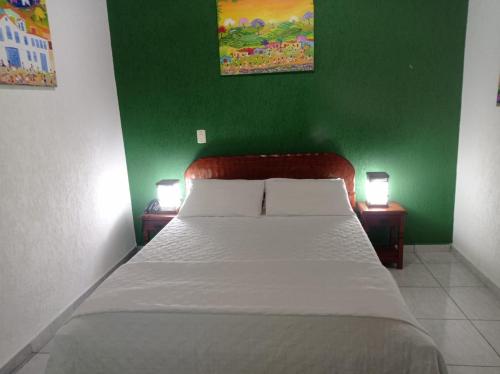 Cama o camas de una habitación en POUSADA CANA DO REINO