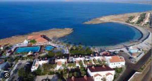 an aerial view of a resort near a body of water at Vila Paradise Sea & Swimming Pool View in Beirona